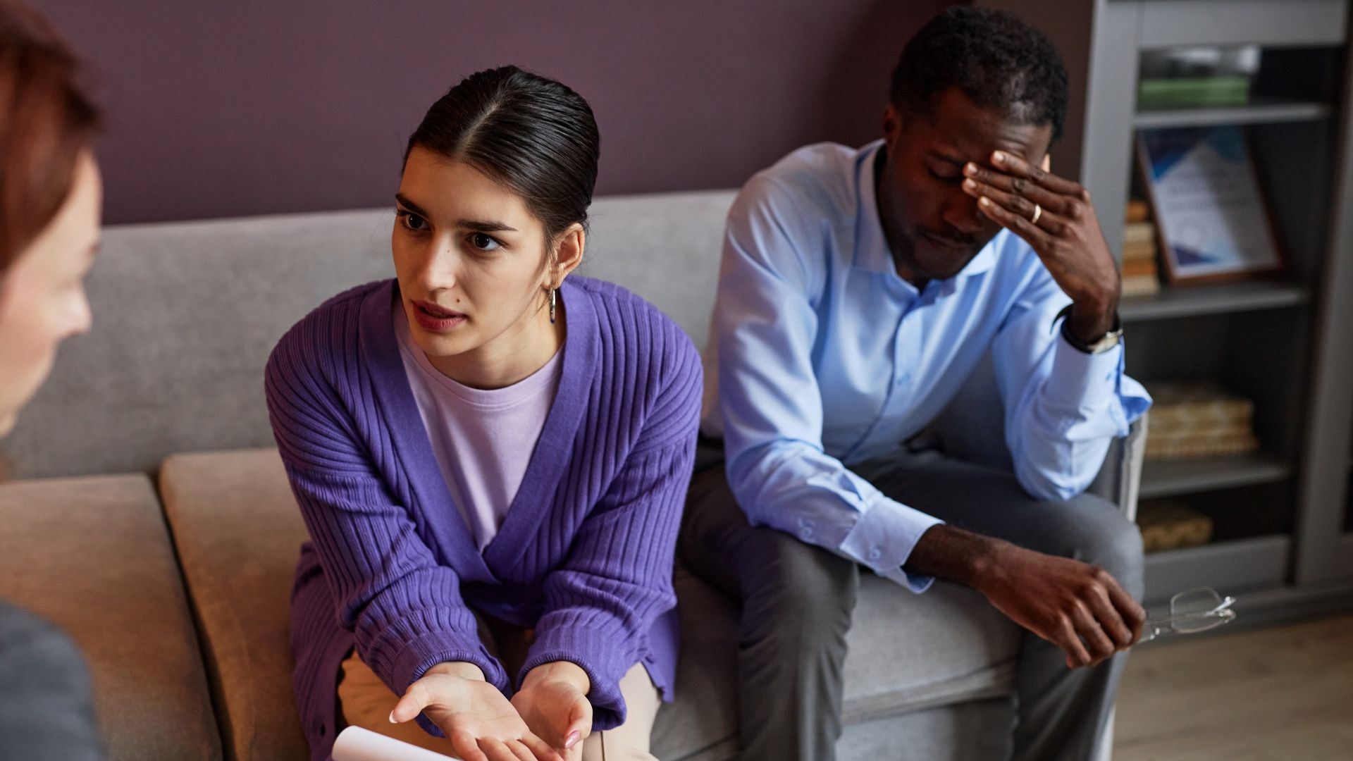 Woman in family psychologist session discussing relationship distress and wondering should I get a divorce.